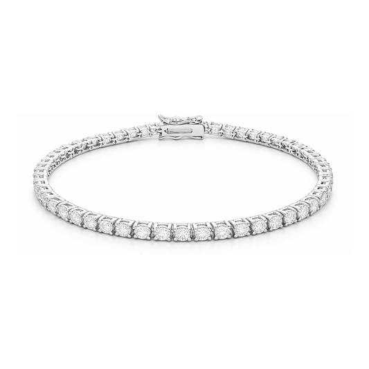 Studio view of a classic tennis bracelet featuring a continuous row of round cubic zirconia stones set in a silver tone finish with a box clasp closure.