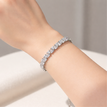 Divinity tennis bracelet worn on the wrist, highlighting elegant proportions and refined sparkle.